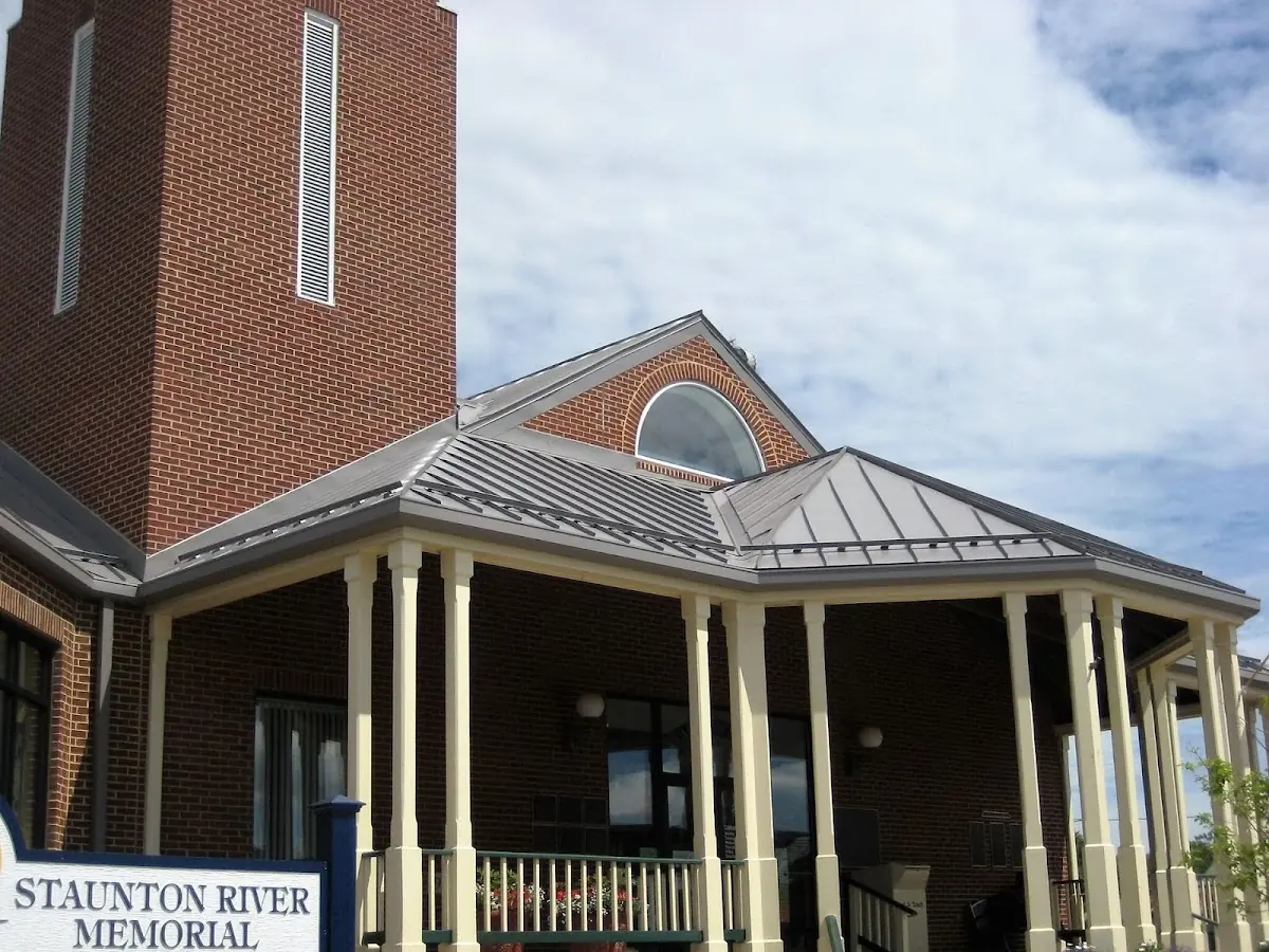 Skilled roofing craftsmen working on a residential roof in Morgan State University
